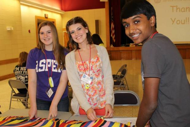 We spend half of Saturday on service projects. Here the girls are working on making blankets for the homeless.